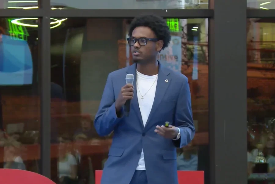 Natan Negede speaking at an event